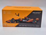 McLaren Modell Autó - Bburago Lando Norris - Miami Festés - Akril Doboz - MCL38